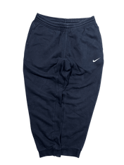 Sötétkék Nike férfi melegítőnadrág vintage streetwear stílusban, elasztikus derékkal.