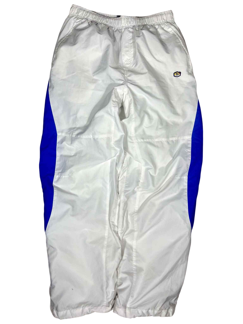 Fehér és kék vintage streetwear melegítőnadrág, gumírozott derékkal, oldalzsebekkel.